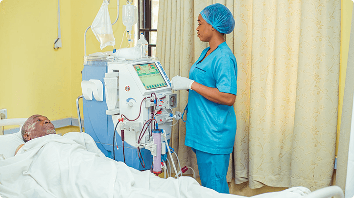 Nurse operating a dialysis machine at Niger Foundation Hospital
