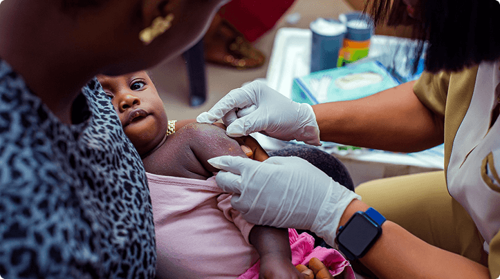 Health worker administering an immunisation during a rural outreach
