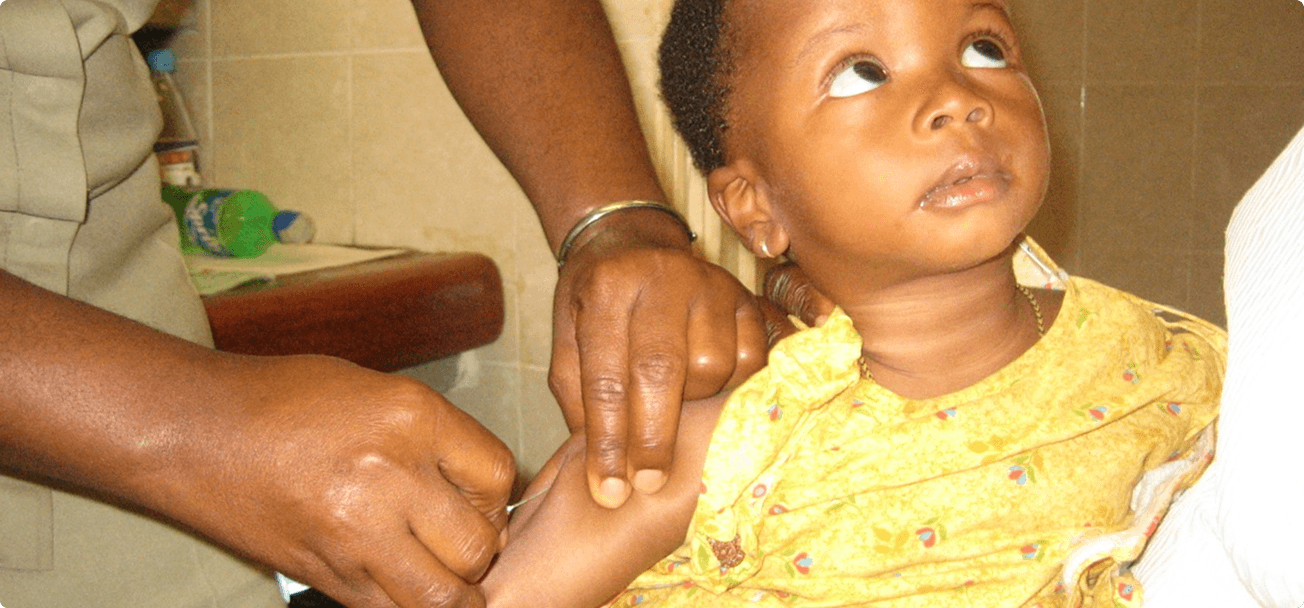 Child receiving immunisation at the Iwollo Rural Health Centre