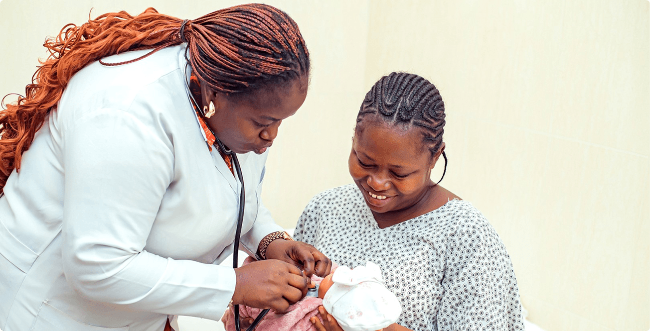 Niger Foundation Hospital doctor with a mother and her newborn